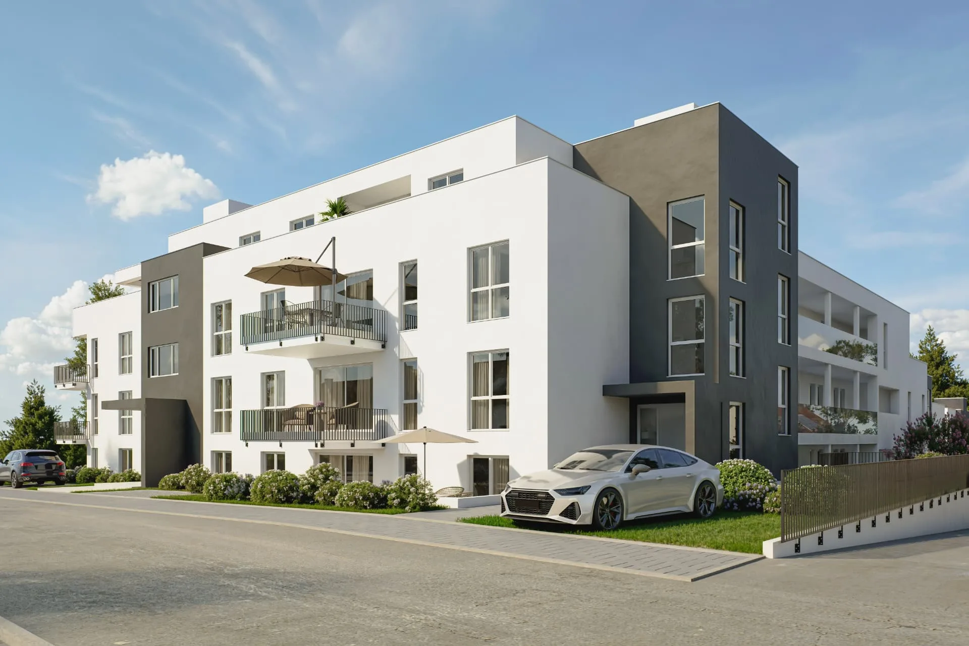 Visualisierung des Novum Quartier Ertingen: weißer Neubau mit grauen Akzenten, Balkonen und begrüntem Eingangsbereich